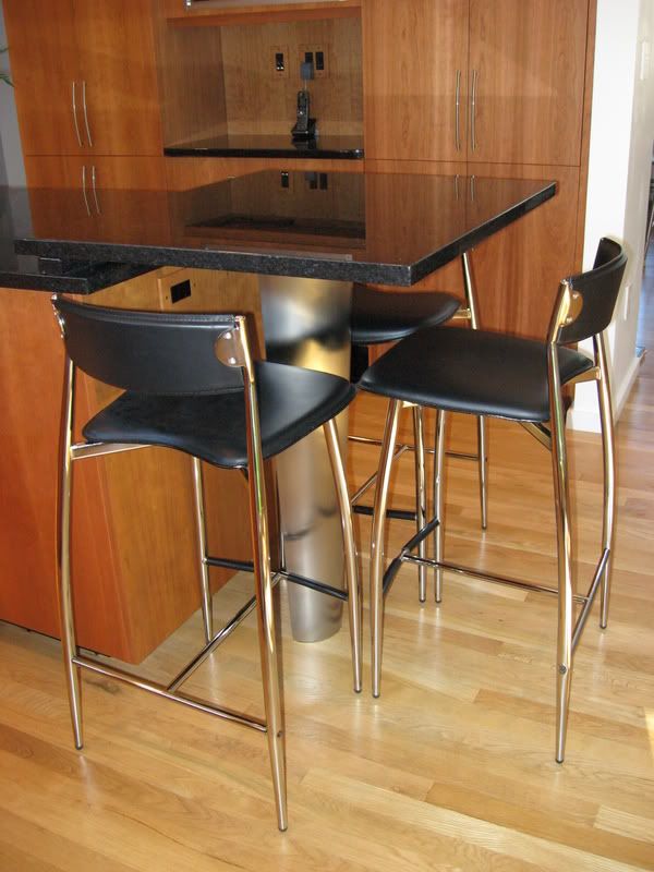 tabletop, stools, and SS leg, Tabletop with stainless steel leg. Baba (black) leather counter stools.
